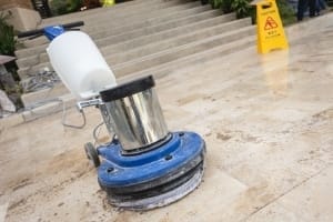 Commercial cleaning technology - Close up blue polishing machine on the floor