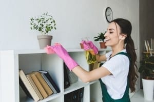 Office Cleaning Services Kelowna - Woman doing high dusting