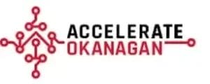 Logo for Accelerate Okanagan featuring a red network circuit design to the left of the words "Accelerate Okanagan," with "Accelerate" in black and "Okanagan" in red, evoking innovation and professionalism akin to top commercial cleaning brands.