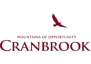 Cranbrook logo with a maroon flying bird above the words “Mountains of Opportunity Cranbrook” on a light background, representing excellence in property maintenance and commercial cleaning.