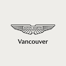 The image shows the Aston Martin logo—stylized outstretched wings with "ASTON MARTIN" in the center—above the word "Vancouver" on a light gray background, suggesting luxury commercial cleaning and property maintenance services.
