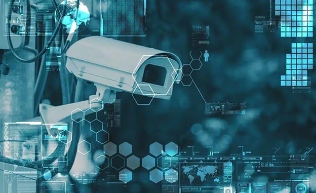 A security camera is mounted outdoors, surrounded by digital graphics including hexagons, data charts, and world maps, symbolizing surveillance, technology, and data analysis.
